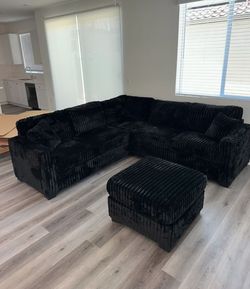 Stylish black sectional sofa with ottoman Fur-like Jumbo Corduroy