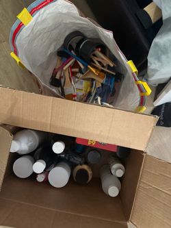 A bunch of acrylic paint + brushes + canvases