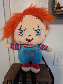 Chucky plush mini backpack from Spencer's, featuring the iconic Character w/  Orange Hair and "Good Guys"