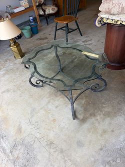 Glass coffee table with iron base