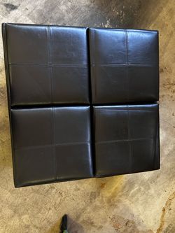 Upholstered ottoman with trays and stools in storage