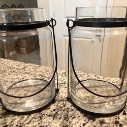 Metal and glass hurricane candle holders