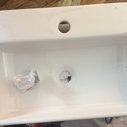 White rectangular bathroom sink, single faucet hole