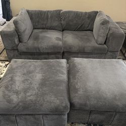 Grey Couch with two ottomans