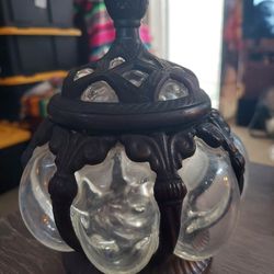 I am.
 Selling this beautiful decorative piece. It has bubble glass all the way around it made with metal.