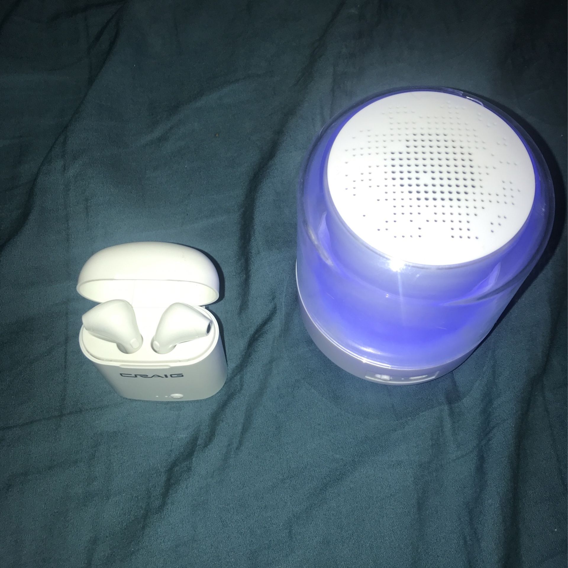 Bluetooth Headphones And A Bluetooth Speaker