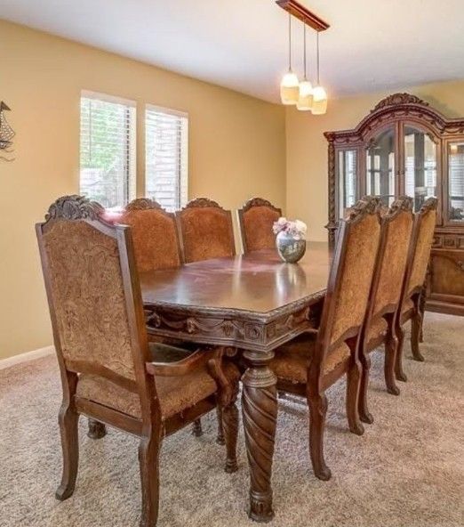 Ashley Furniture North Shore traditional dining set with a rectangular table and upholstered chairs.