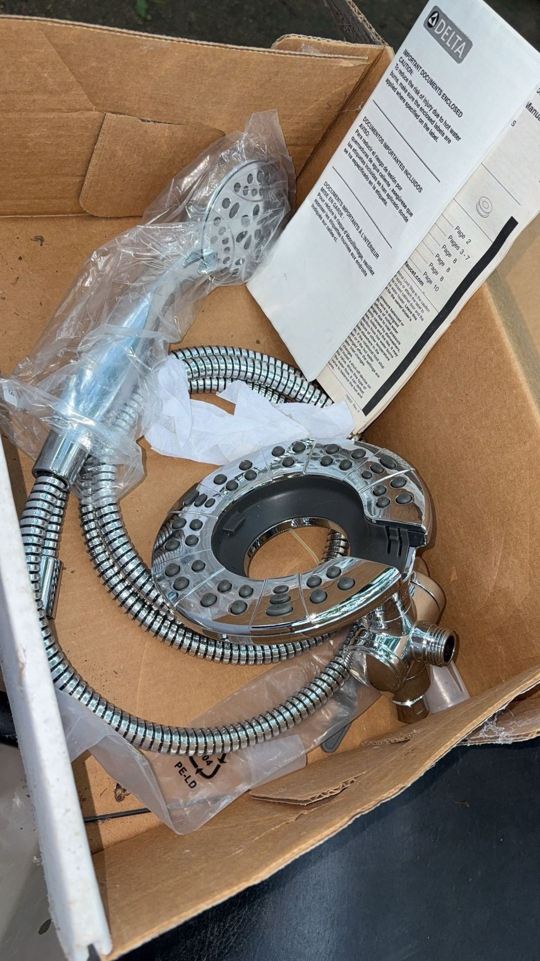 Brand New Delta inition two in one shower head