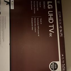 LG TV UHD 50 inch and black tv console table