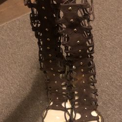 Brown heeled strapy leg sandals