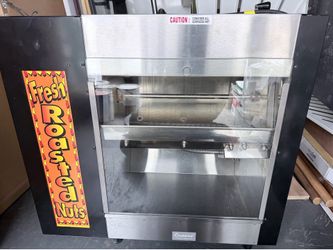 The C. Cretors & Co. Peanut Tosty (Model 14046A) is a highly specialized commercial countertop peanut roaster and warmer.