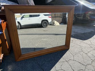 Large wood-framed wall mirror