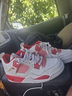 Air Jordan 4 White and Red Sneakers