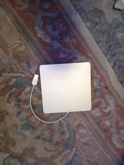 Apple USB SuperDrive external CD/DVD drive.