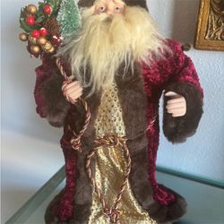 Vintage standing Santa with a red velvet and fur coat