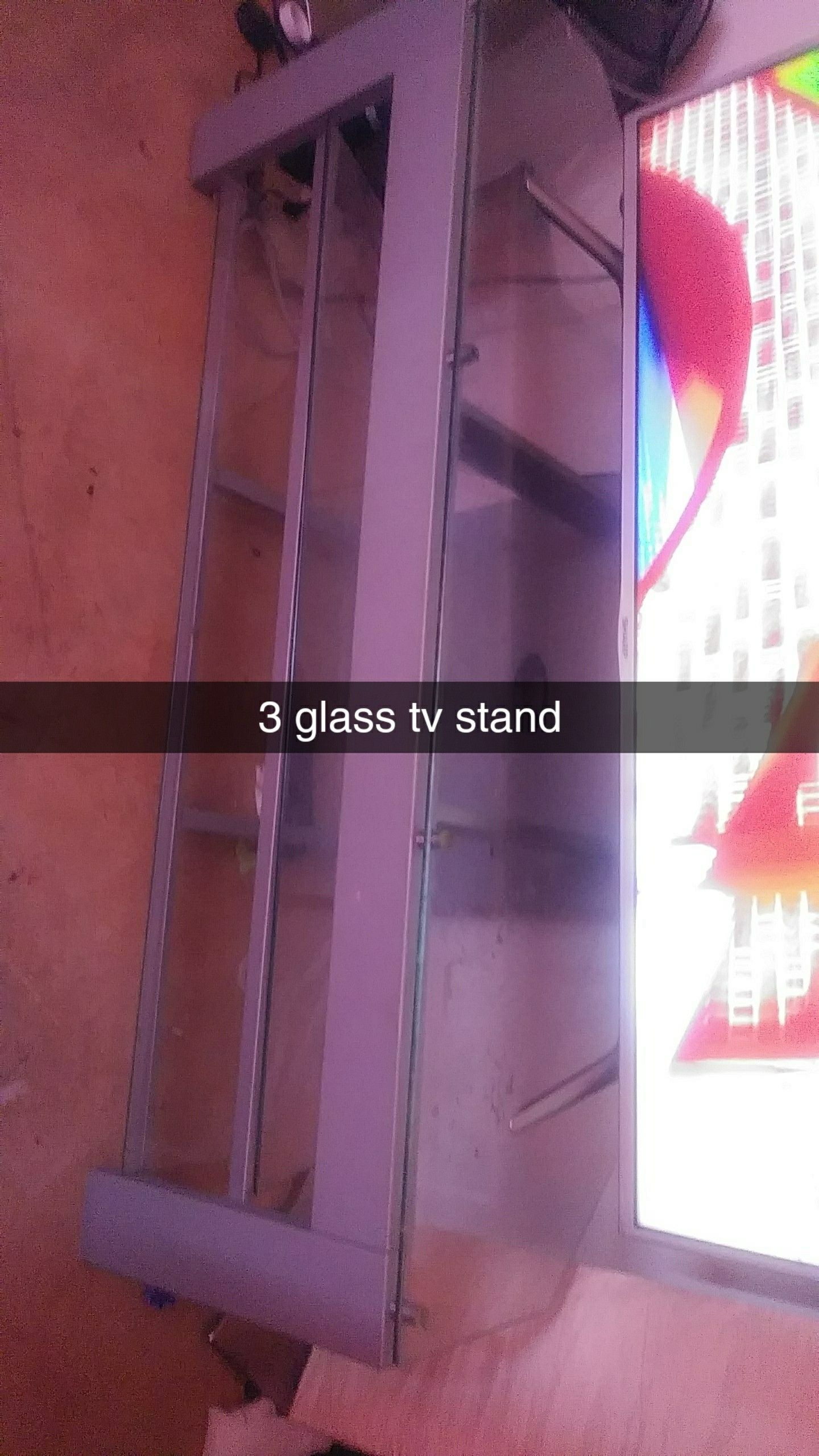 Glass tv stand holds 55 in
