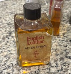 vintage bottle of English Leather After Shave produced by the MEM Company, Inc., originally based out of Northvale, New Jersey.