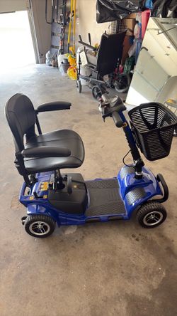 Blue electric 4 wheel rascal scooter (almost brand new)