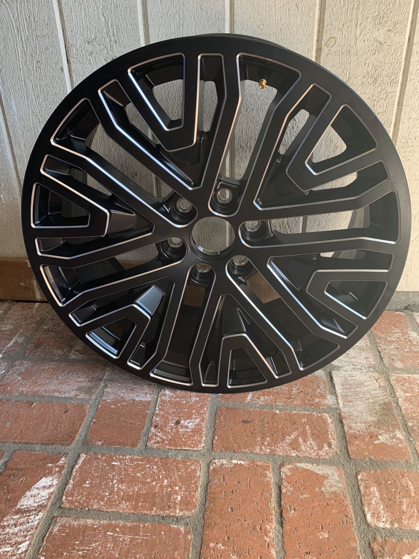 22’ Brand New Rims - Never Been Used. Set of four six lug nuts.