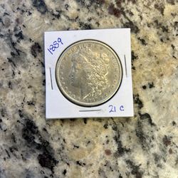 1889 MORGAN SILVER DOLLAR.   (21c)