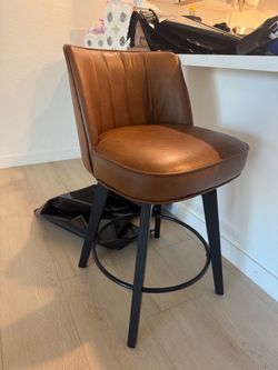 2 brown leather bar stools