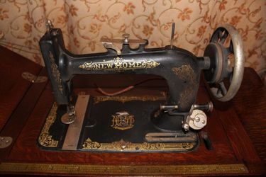 Antique New Home Sewing Machine Series A and Table with Attachments