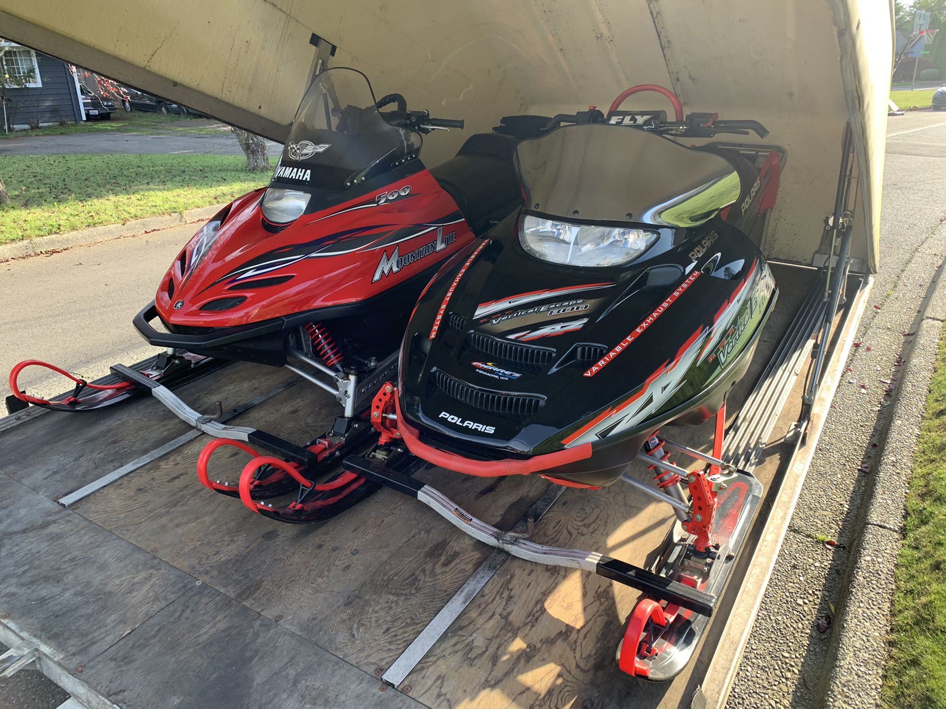 Snowmobile and Trailer. 2003 Polaris RMK Vertical Escape 800, 2001 Yamaha Mountain Light 500. 2000 covered drive on/off trailer