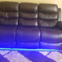 Brown leather sofa with light fixture