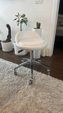 White adjustable office stool on wheels