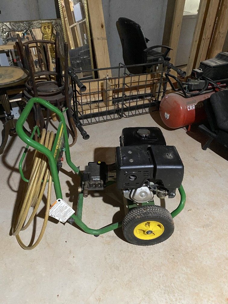 Green and Black Pressure Washer with Yellow Wheels