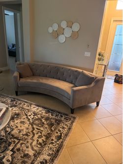 Two curved couches