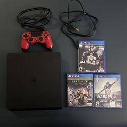 PS4 Slim Console With A Controller And Games