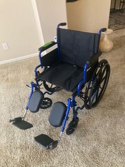 Wheelchair New with 20” seat and Elevating Footrests