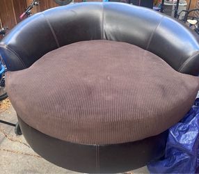 Oversized brown swivel cuddle chair