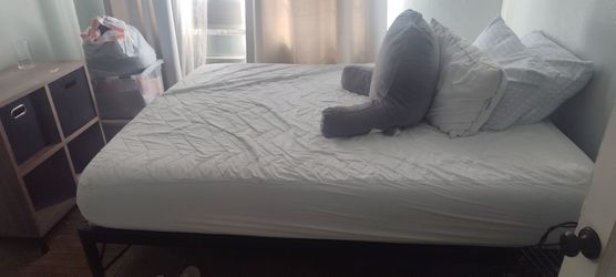 Free Queen size bed, high frame for storage. Must pick up and take apart