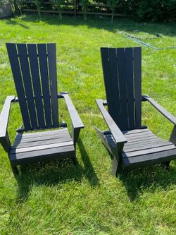 Two wood black Adirondack chairs