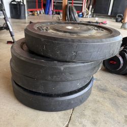 Four 45 Lb Barbel Bumper Plates