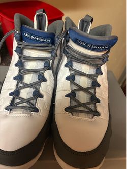 White and blue and gray Jordans 9s