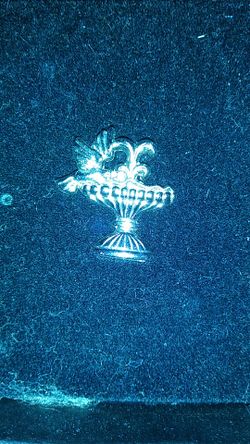 Silver Bracelet Charm. - Bird on a water fountain.