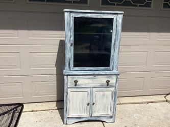 Country all wood cupboard ( white wash paint)bubble glass door opens 3 shelves ,drawer,door opens to storage  32 wide- 16.25 deep- 65 Tall..must see p