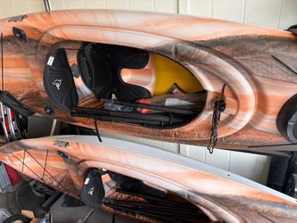 Pelican Mustang Kayaks with Paddles and Seats and Storage Stand