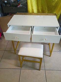 2 Drawers Makeup table with chair. Table L31in. D15.5in. H 29in. Chair L 15. D11. H 16.5. Metal frame. ---AS IS