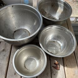 Four Stainless Bowls Varying Sizes Used In My Gardening Shed 
