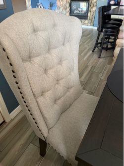 Kitchen table with four chairs and one bench, so can seat 6