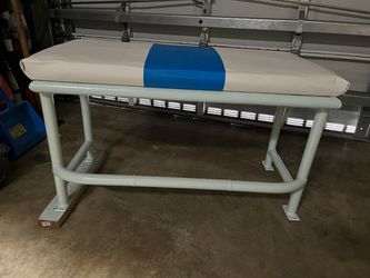 Boat center seat with white and blue leather cushion and a white powder-coated metal frame. Freshly painted frame and new cushion. Weather-resistant a