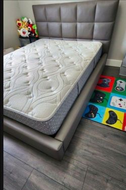 Queen-size bed with mattress