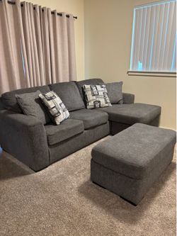 Grey couch with ottoman