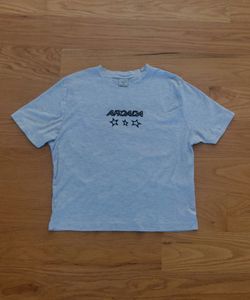 Cotton On shirt with graphic text "ARCADA" size small