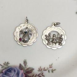 2 Jamaica silver charms 