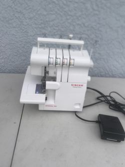 Singer Finishing Touch Serger Sewing Machine Model 14SH654. Dry tested( powered on all knobs worked including food pedal. (No actual sewing were perfo